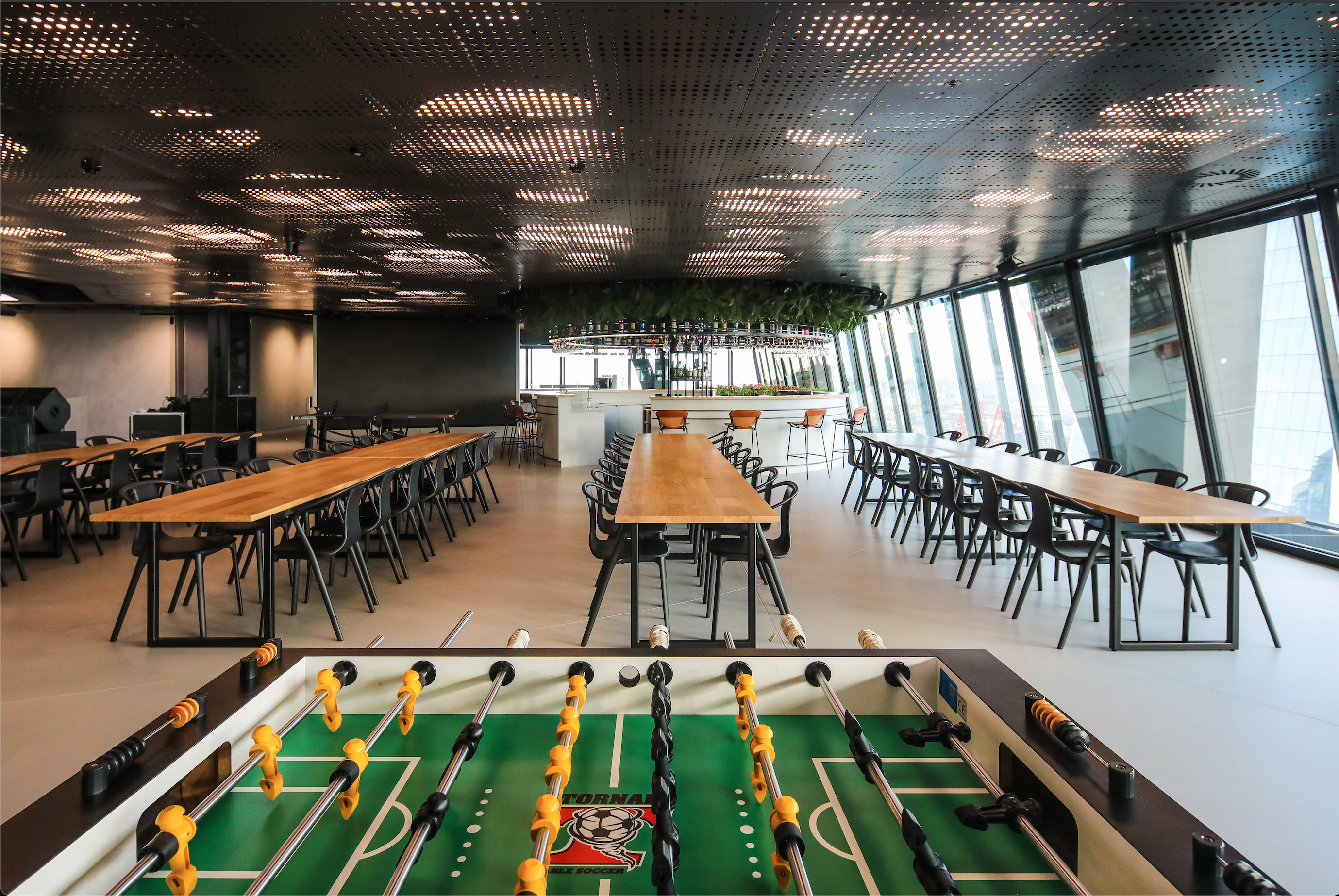 Breakout space with football table and bar.