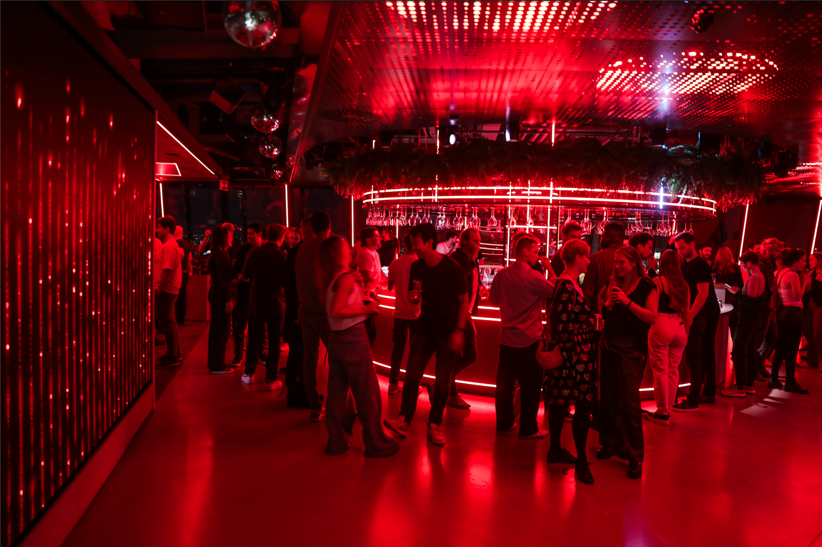 People in the breakout space socalising after a social.