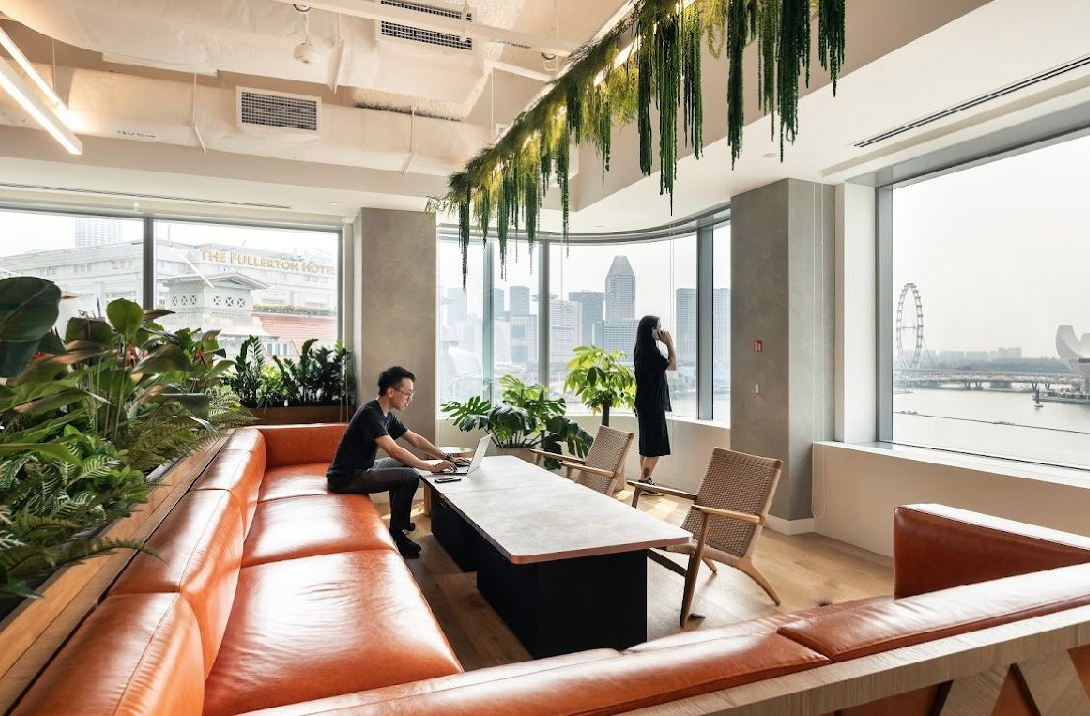 People in breakout space overlooking the city