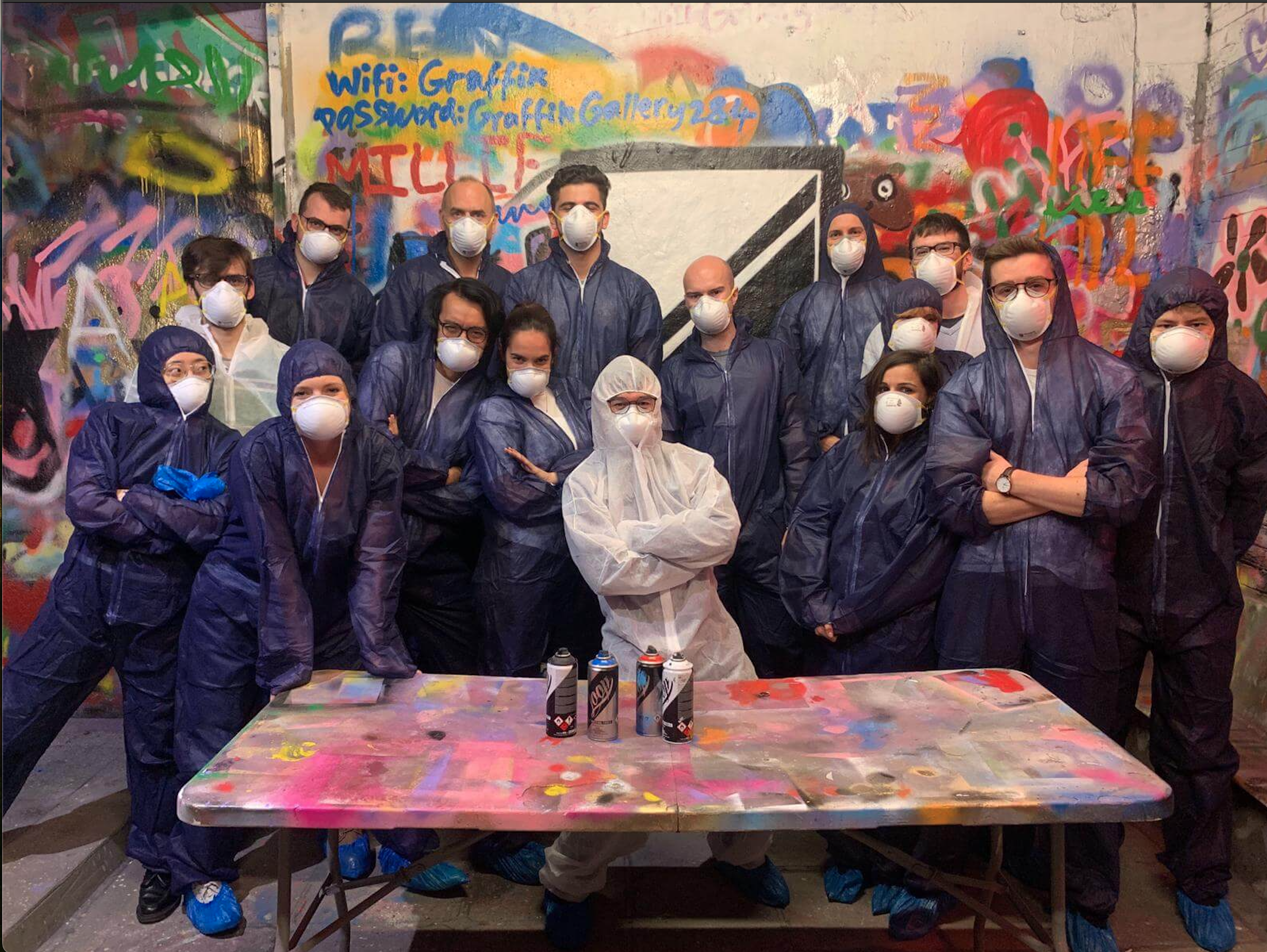 Quadrature team posing in body suits at a spray painting event
