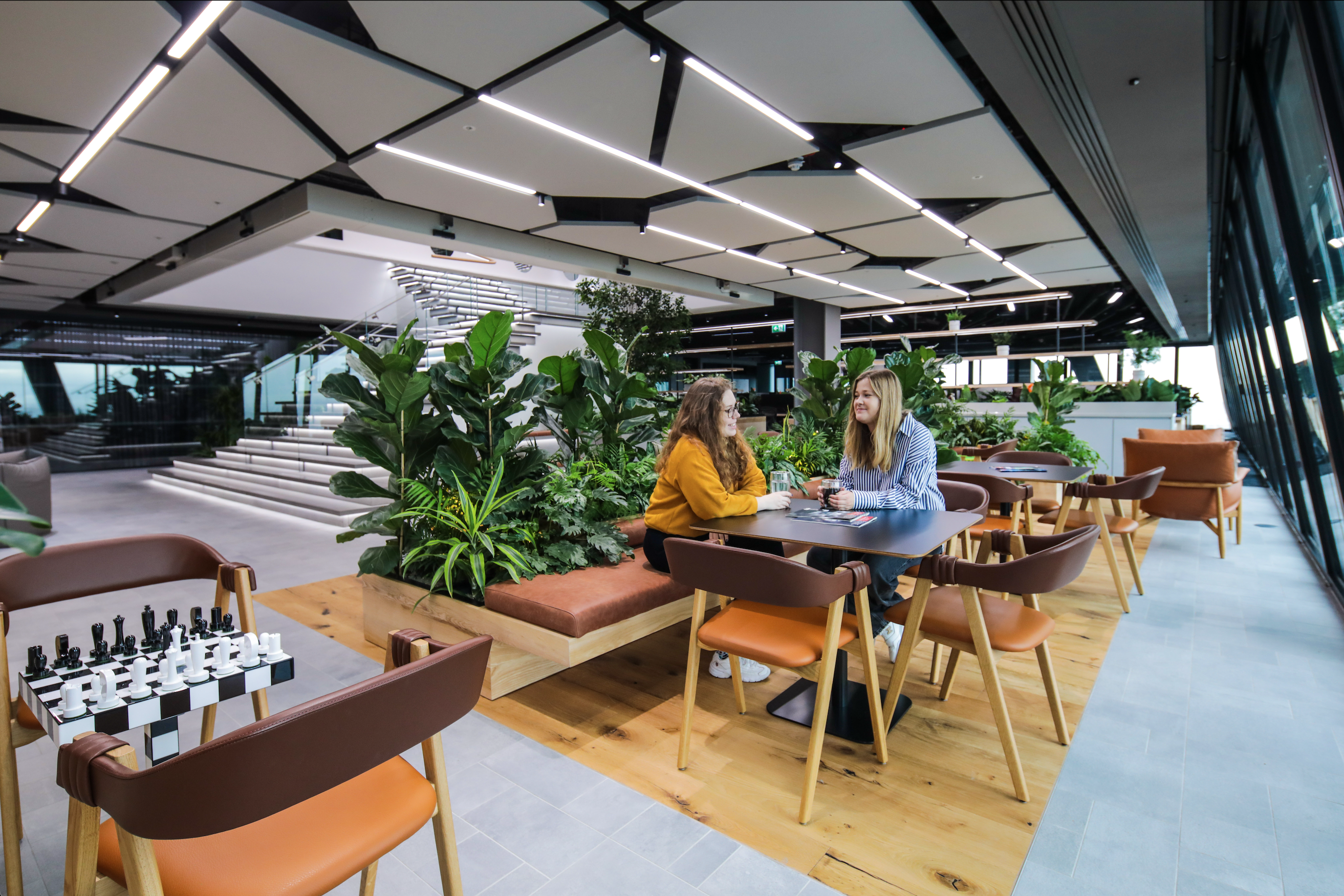 Two Quadrature employees working at desks